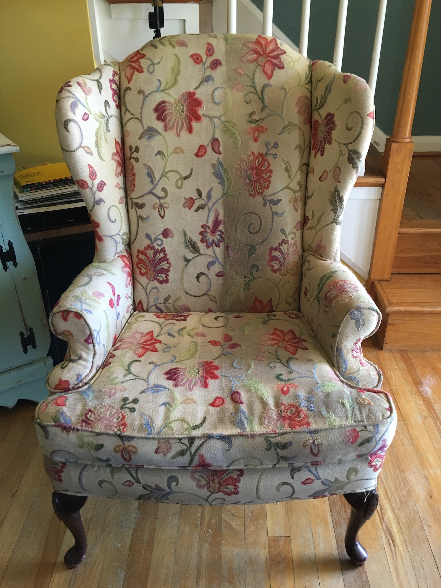 Floral wingchair before upholstery cleaning